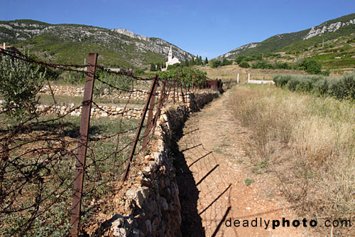Barbed wired fence, near town of Komiza, Island of Vis, Croatia