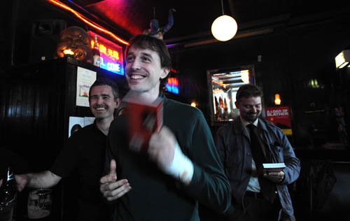 Barry shows how quick our book moves. Dave grins. Duncan looks bemused.